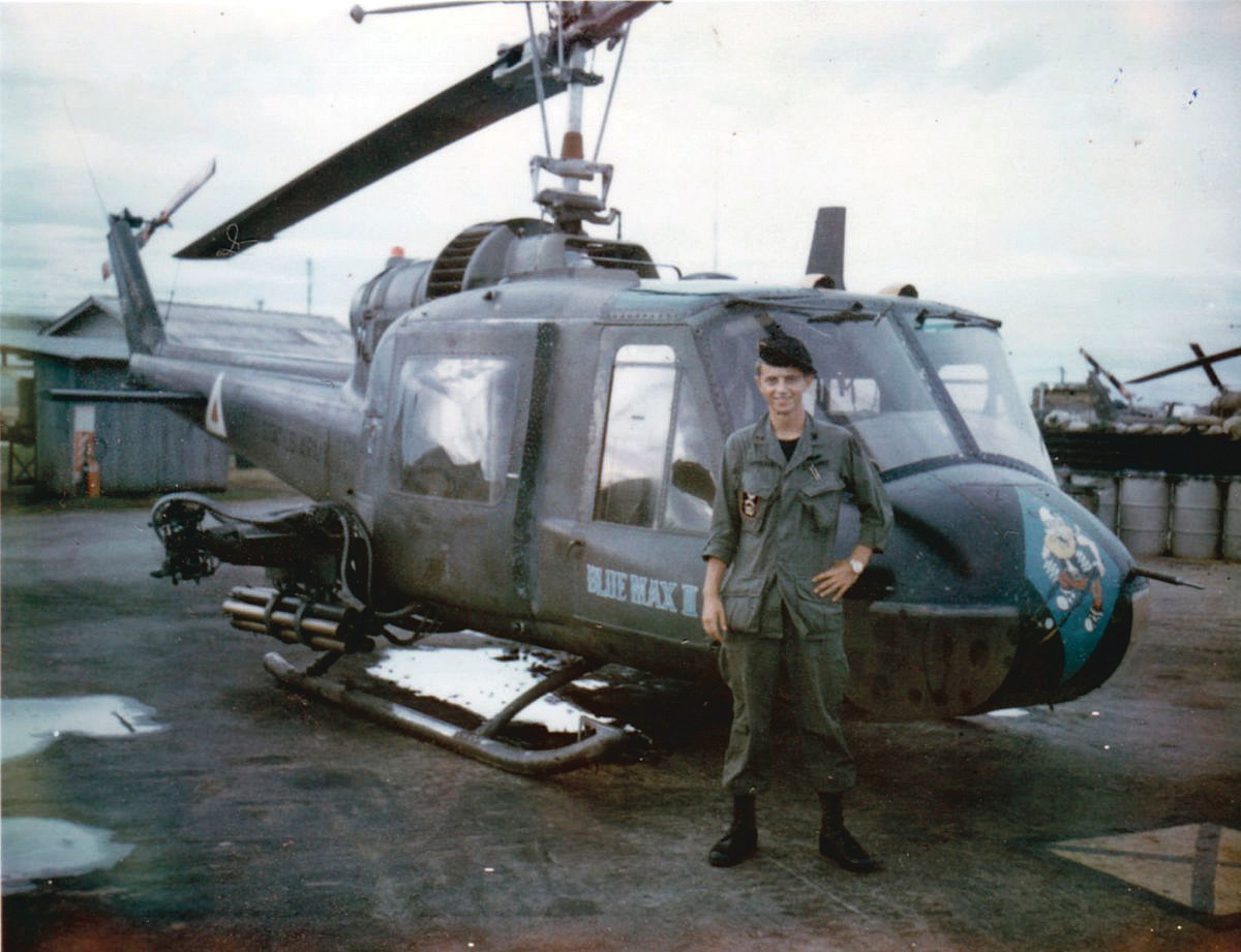 Dan Swecker is pictured in front of one of the helicopters he flew while serving in the U.S. Army during the Vietnam War.